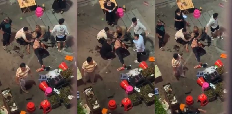 广西百色乐业县 一水果摊商贩与帽子叔叔发生争执后 竟持刀当街威胁 后被围观群众合力救出！-51吃瓜网